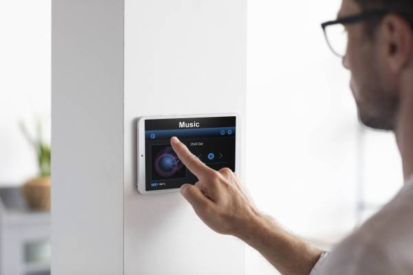 man-using-tablet-his-smart-home